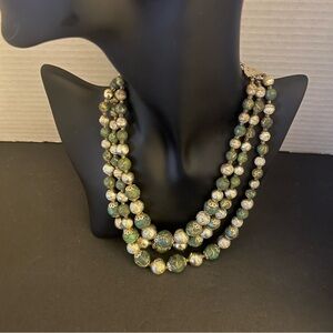 Good, preowned vintage condition green stone three strands necklace